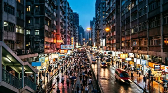 Busy pedestrian street in Mong Kok district with dense crowds and urban energy