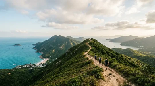 Hikers walking along the scenic Dragon's Back ridge trail with panoramic coastal views in Hong Kong