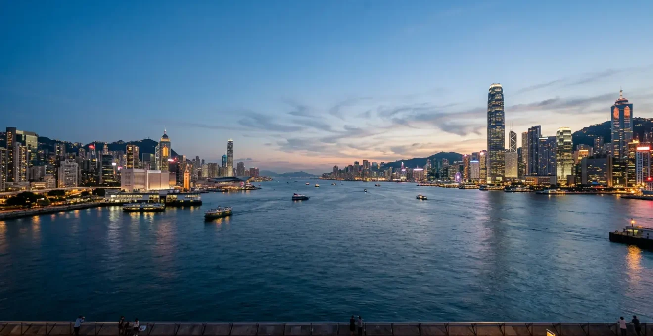 Panoramic view of Victoria Harbour with Kowloon and Hong Kong Island skylines facing each other across the water
