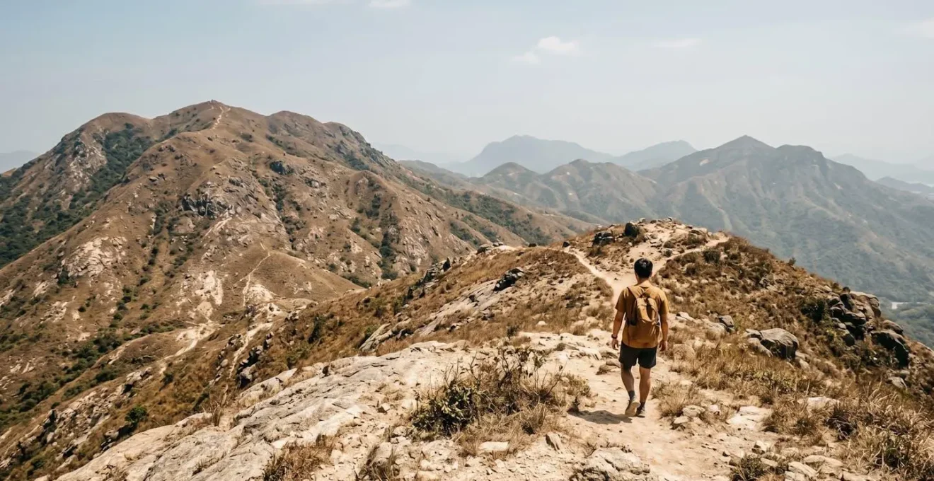Lone hiker silhouette on exposed mountain trail under intense sun with barren landscape emphasizing isolation and heat