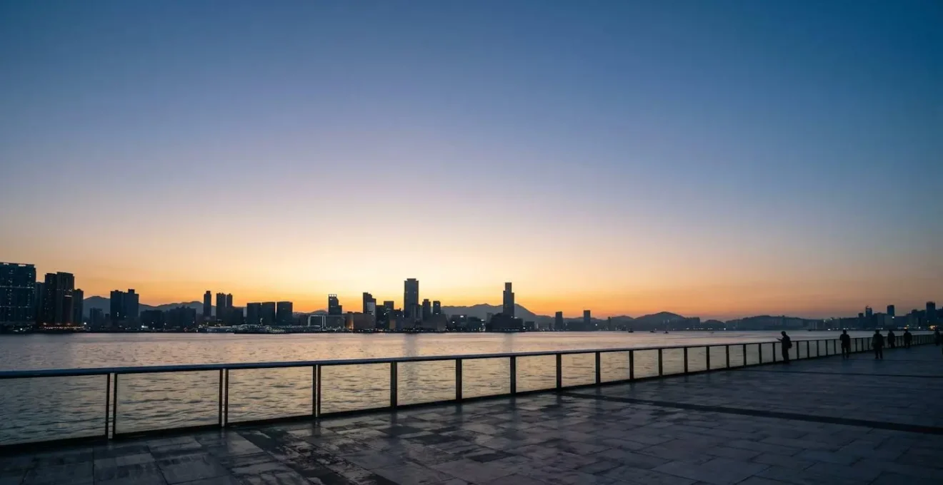 Panoramic view of Victoria Harbour waterfront at dusk with negative space for fireworks display